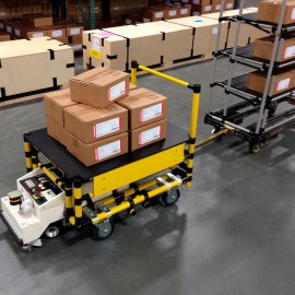 Towing AGV trolley for material handling